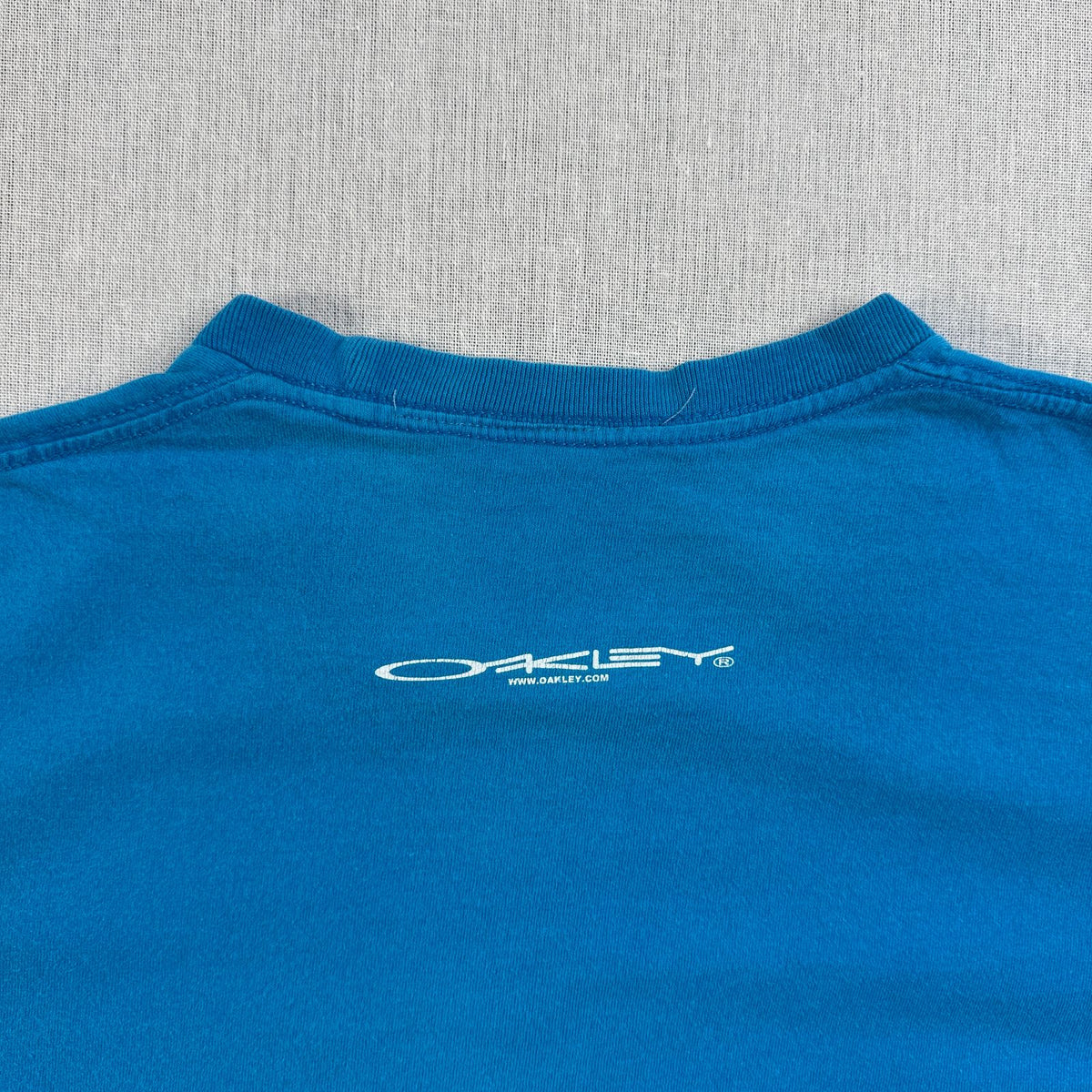 90s OAKLEY オークリー Tシャツ サーフボード surf 青 水色 2603-0291