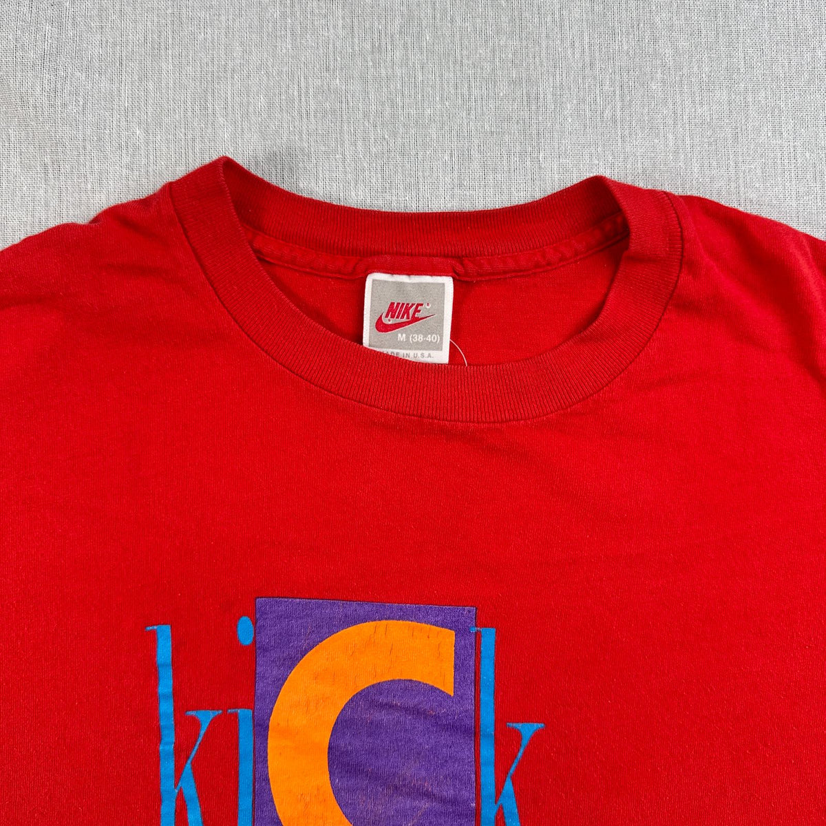 90s ナイキ NIKE Tシャツ ロゴ 赤 USA製 KICK SOME BUTT シングルステッチ 2604-0105